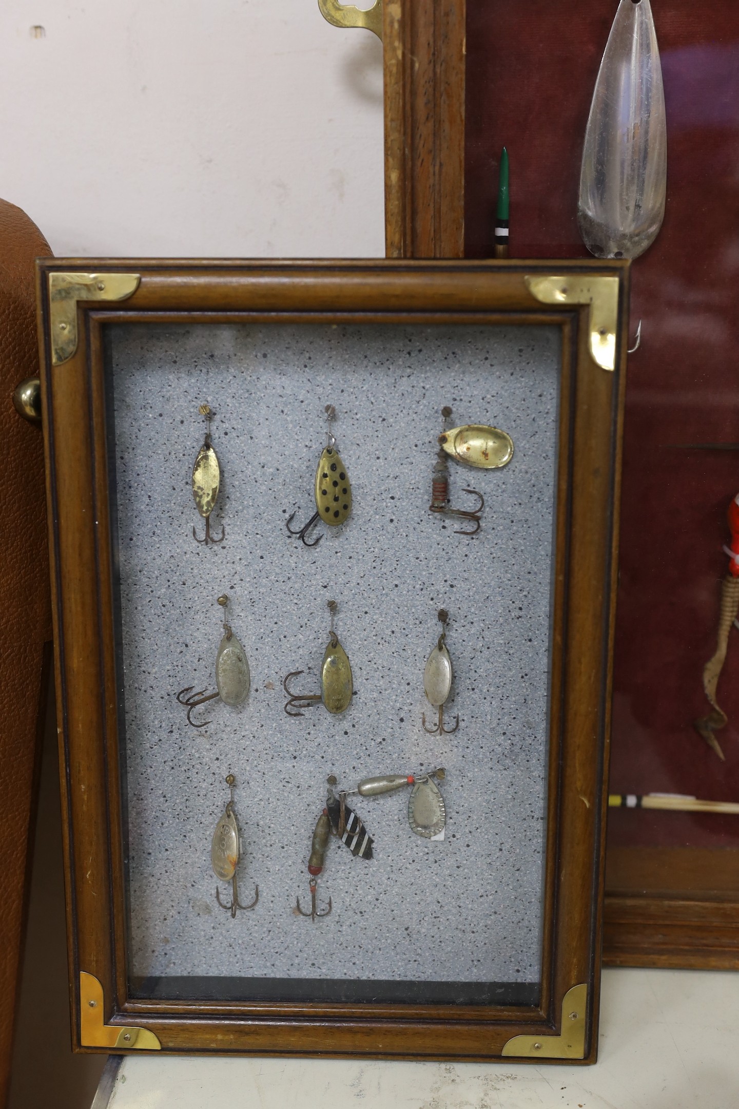 Two cased sets of fishing lures